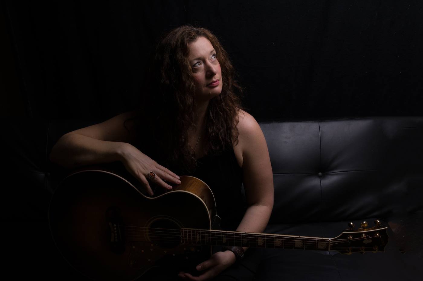 Guitar in her lap