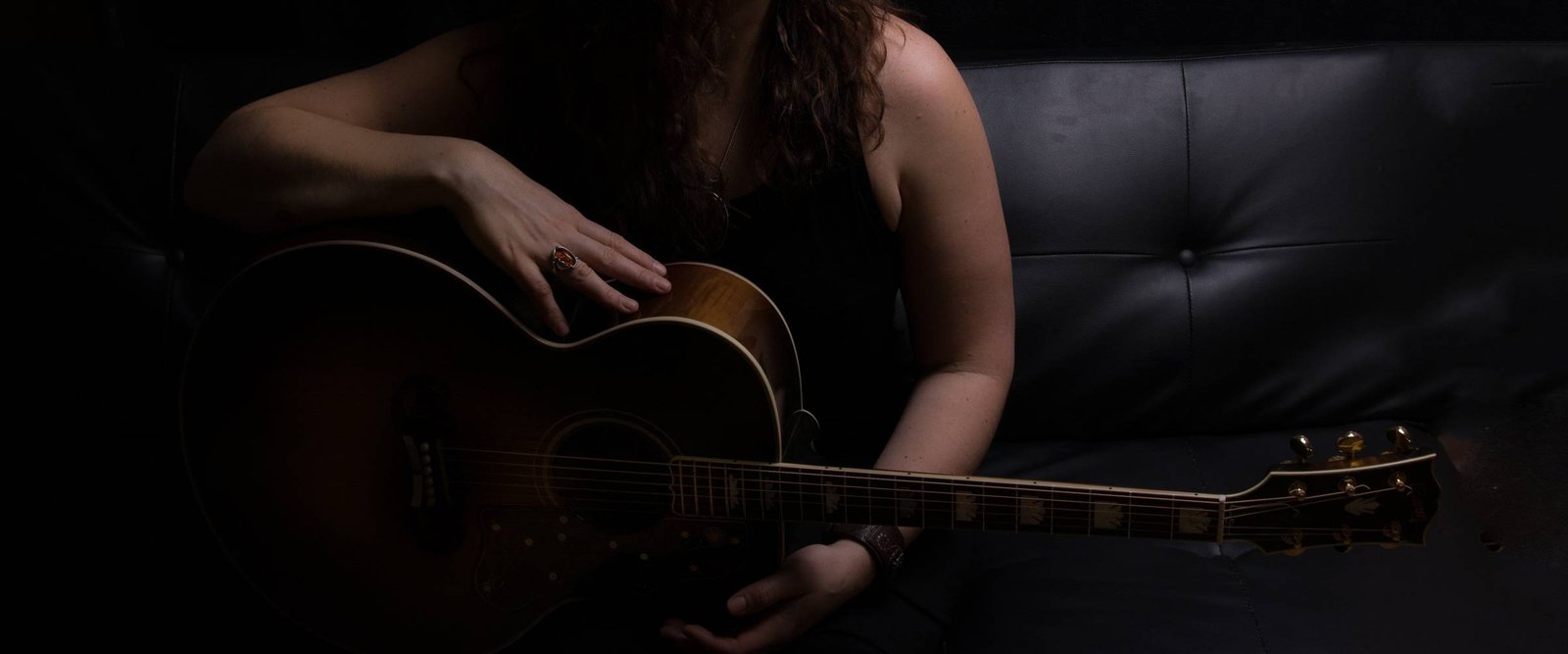 Lindsay May with her guitar